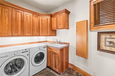 This exceptional 4-bedroom, 5-bathroom mountain retreat offers on Raven Golf Club At Three Peaks in Colorado - for sale on GolfHomes.com, golf home, golf lot