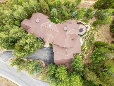This exceptional 4-bedroom, 5-bathroom mountain retreat offers on Raven Golf Club At Three Peaks in Colorado - for sale on GolfHomes.com, golf home, golf lot