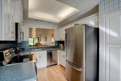 Well-maintained 2nd-floor condo with direct views of the 14th on Boca Delray Golf and Country Club in Florida - for sale on GolfHomes.com, golf home, golf lot
