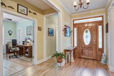 This custom Southern Living-style home sits on a tranquil pond on Santee National Golf Course in South Carolina - for sale on GolfHomes.com, golf home, golf lot