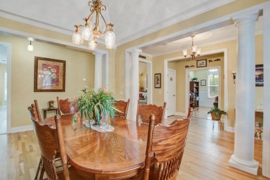 This custom Southern Living-style home sits on a tranquil pond on Santee National Golf Course in South Carolina - for sale on GolfHomes.com, golf home, golf lot