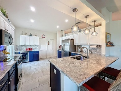 Fabulous St Regis model with  2.5 car garage located on The on Kings Ridge Golf Club in Florida - for sale on GolfHomes.com, golf home, golf lot