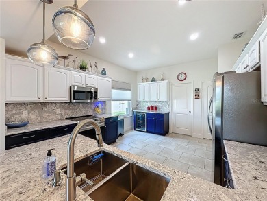Fabulous St Regis model with  2.5 car garage located on The on Kings Ridge Golf Club in Florida - for sale on GolfHomes.com, golf home, golf lot