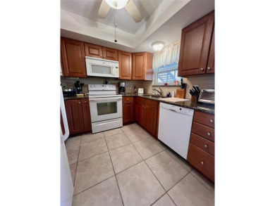 Experience the tranquility of waterfront living in this charming on Gulf Harbors Golf Course in Florida - for sale on GolfHomes.com, golf home, golf lot