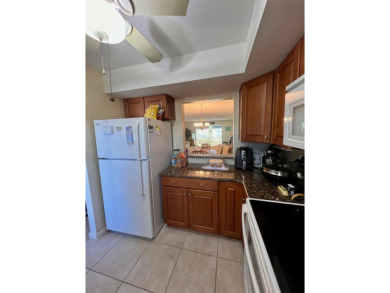 Experience the tranquility of waterfront living in this charming on Gulf Harbors Golf Course in Florida - for sale on GolfHomes.com, golf home, golf lot
