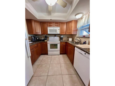 Experience the tranquility of waterfront living in this charming on Gulf Harbors Golf Course in Florida - for sale on GolfHomes.com, golf home, golf lot
