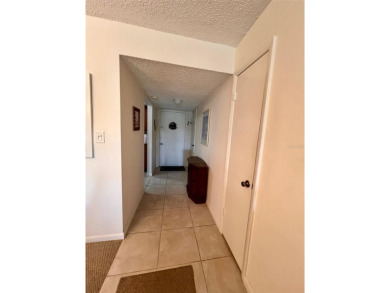 Experience the tranquility of waterfront living in this charming on Gulf Harbors Golf Course in Florida - for sale on GolfHomes.com, golf home, golf lot