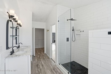 Freshly updated and move-in ready! This expansive 4,120 SF home on Trailhead At Liberty Lake in Washington - for sale on GolfHomes.com, golf home, golf lot