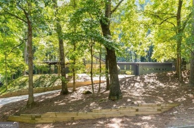 Welcome to this beautiful mid-century ranch-style house located on Rivermont Golf and Country Club in Georgia - for sale on GolfHomes.com, golf home, golf lot