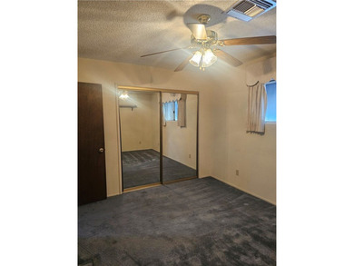 A double-lot home, priced for a quick sale, asking only $349,000 on Chaparral Golf and Country Club in Arizona - for sale on GolfHomes.com, golf home, golf lot