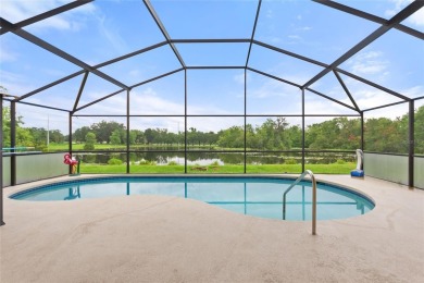 Very nice pool home that is waterfront located in in Ridgewood on Ridgewood Lakes Golf and Country Club in Florida - for sale on GolfHomes.com, golf home, golf lot