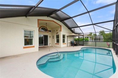 Very nice pool home that is waterfront located in in Ridgewood on Ridgewood Lakes Golf and Country Club in Florida - for sale on GolfHomes.com, golf home, golf lot