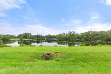 Very nice pool home that is waterfront located in in Ridgewood on Ridgewood Lakes Golf and Country Club in Florida - for sale on GolfHomes.com, golf home, golf lot