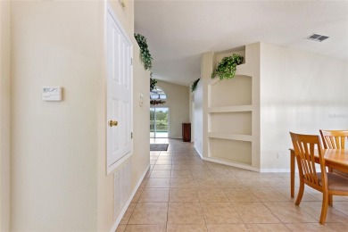 Very nice pool home that is waterfront located in in Ridgewood on Ridgewood Lakes Golf and Country Club in Florida - for sale on GolfHomes.com, golf home, golf lot