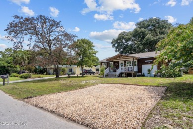 Welcome to 132 NE 3rd St, Oak Island, where laid-back beach on Founders Club At St. James Plantation in North Carolina - for sale on GolfHomes.com, golf home, golf lot