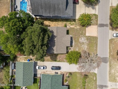 Welcome to 132 NE 3rd St, Oak Island, where laid-back beach on Founders Club At St. James Plantation in North Carolina - for sale on GolfHomes.com, golf home, golf lot