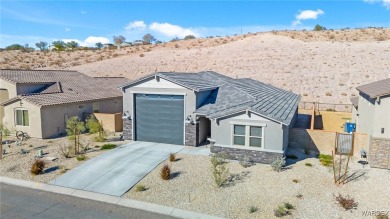 Looking for that PRACTICALLY NEW home with RV GARAGE? Take a on Laughlin Ranch Golf Club in Arizona - for sale on GolfHomes.com, golf home, golf lot