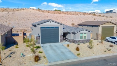 Looking for that PRACTICALLY NEW home with RV GARAGE? Take a on Laughlin Ranch Golf Club in Arizona - for sale on GolfHomes.com, golf home, golf lot