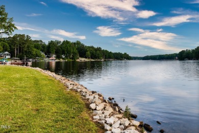 Discover an amazing, wooded lot in the picturesque Lake Royale on River Golf and County Club at Lake Royale in North Carolina - for sale on GolfHomes.com, golf home, golf lot