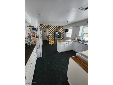 Welcome to this beautiful Colonial-style home ideally located on Henry Stambaugh Golf Course in Ohio - for sale on GolfHomes.com, golf home, golf lot