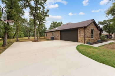 This spacious home boasts an open floor plan, oversized rooms on Sugar Tree Golf and Country Club in Texas - for sale on GolfHomes.com, golf home, golf lot