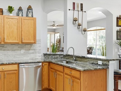 Situated within the gates of Heron Creek Golf & Country Club on Heron Creek Golf and Country Club in Florida - for sale on GolfHomes.com, golf home, golf lot