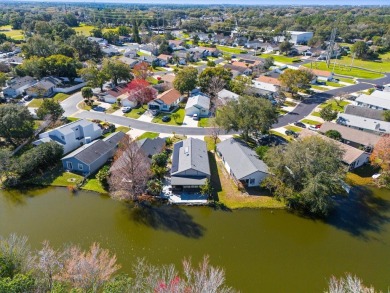 House with a lake in the backyard in a prime location right in on Mayfair Country Club in Florida - for sale on GolfHomes.com, golf home, golf lot