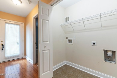 Enjoy the ease of one-level living in this low-maintenance on Masonboro Country Club in North Carolina - for sale on GolfHomes.com, golf home, golf lot