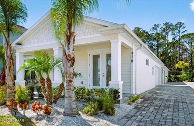 Discover the charm of this coastal style home, crafted by the on Venetian Bay Golf Course in Florida - for sale on GolfHomes.com, golf home, golf lot