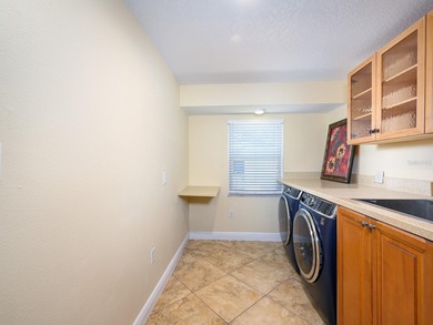 This exceptional lakefront gem is a nearly 2,000-square-foot on Gulf Gate Golf Club in Florida - for sale on GolfHomes.com, golf home, golf lot