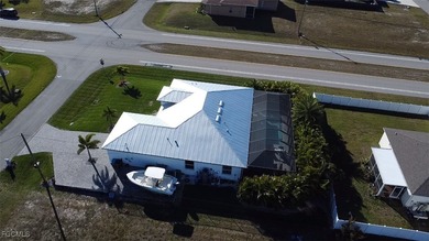 Experience elevated coastal luxury in this impeccably designed on Burnt Store Golf Club in Florida - for sale on GolfHomes.com, golf home, golf lot