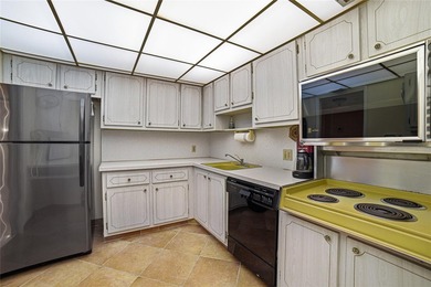 Discover sweeping golf course views from this desirable on Palm-Aire Country Club and Resort - The Oaks in Florida - for sale on GolfHomes.com, golf home, golf lot