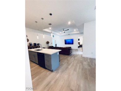 Experience elevated coastal luxury in this impeccably designed on Burnt Store Golf Club in Florida - for sale on GolfHomes.com, golf home, golf lot