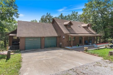 Set on a gently sloping, beautifully landscaped lot in a quiet on Holiday Island Executive Golf Course in Arkansas - for sale on GolfHomes.com, golf home, golf lot