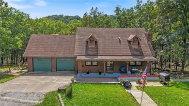 Set on a gently sloping, beautifully landscaped lot in a quiet on Holiday Island Executive Golf Course in Arkansas - for sale on GolfHomes.com, golf home, golf lot