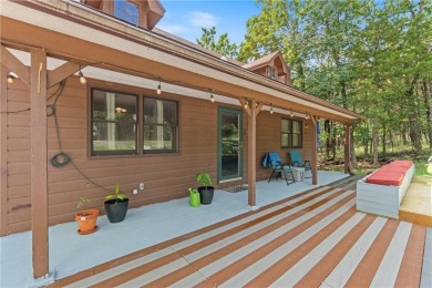 Set on a gently sloping, beautifully landscaped lot in a quiet on Holiday Island Executive Golf Course in Arkansas - for sale on GolfHomes.com, golf home, golf lot