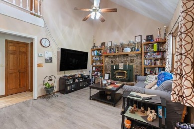 Set on a gently sloping, beautifully landscaped lot in a quiet on Holiday Island Executive Golf Course in Arkansas - for sale on GolfHomes.com, golf home, golf lot