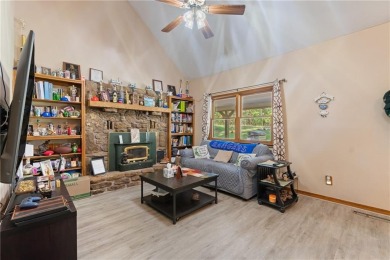 Set on a gently sloping, beautifully landscaped lot in a quiet on Holiday Island Executive Golf Course in Arkansas - for sale on GolfHomes.com, golf home, golf lot