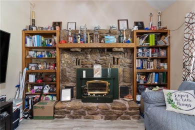 Set on a gently sloping, beautifully landscaped lot in a quiet on Holiday Island Executive Golf Course in Arkansas - for sale on GolfHomes.com, golf home, golf lot