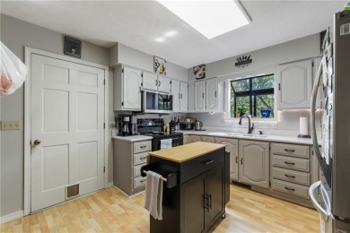 Set on a gently sloping, beautifully landscaped lot in a quiet on Holiday Island Executive Golf Course in Arkansas - for sale on GolfHomes.com, golf home, golf lot