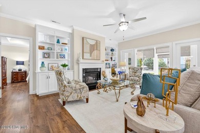 The welcoming front porch sets the tone for this beautiful home on Members Club At St. James Plantation in North Carolina - for sale on GolfHomes.com, golf home, golf lot
