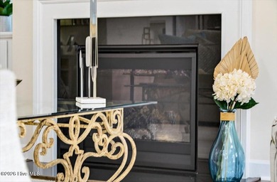 The welcoming front porch sets the tone for this beautiful home on Members Club At St. James Plantation in North Carolina - for sale on GolfHomes.com, golf home, golf lot