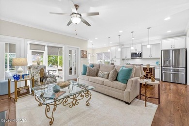 The welcoming front porch sets the tone for this beautiful home on Members Club At St. James Plantation in North Carolina - for sale on GolfHomes.com, golf home, golf lot