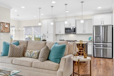 The welcoming front porch sets the tone for this beautiful home on Members Club At St. James Plantation in North Carolina - for sale on GolfHomes.com, golf home, golf lot