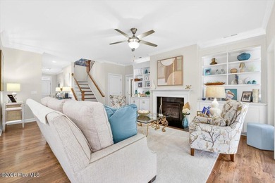 The welcoming front porch sets the tone for this beautiful home on Members Club At St. James Plantation in North Carolina - for sale on GolfHomes.com, golf home, golf lot