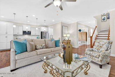 The welcoming front porch sets the tone for this beautiful home on Members Club At St. James Plantation in North Carolina - for sale on GolfHomes.com, golf home, golf lot