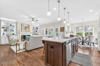 The welcoming front porch sets the tone for this beautiful home on Members Club At St. James Plantation in North Carolina - for sale on GolfHomes.com, golf home, golf lot