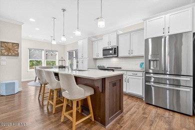 The welcoming front porch sets the tone for this beautiful home on Members Club At St. James Plantation in North Carolina - for sale on GolfHomes.com, golf home, golf lot