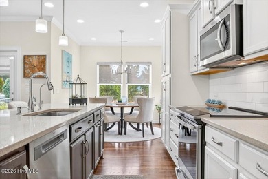 The welcoming front porch sets the tone for this beautiful home on Members Club At St. James Plantation in North Carolina - for sale on GolfHomes.com, golf home, golf lot