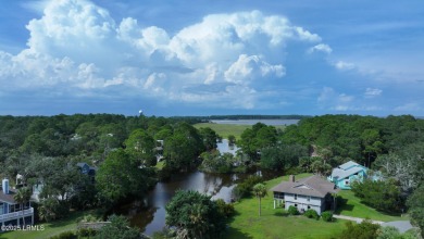 Nestled in Skimmer Cove on Blue Heron Lake, this home offers one on Ocean Point Golf Links in South Carolina - for sale on GolfHomes.com, golf home, golf lot